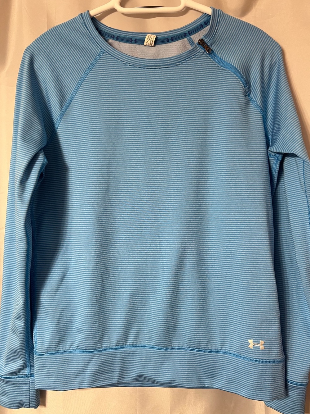 Under Armour Woman’s Blue Striped Pullover With Side Neck Zip. P2P approx 19.5”